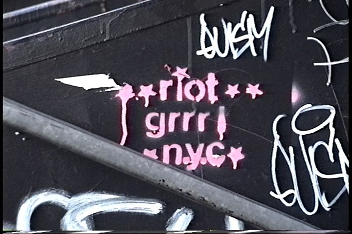 Pink graffiti that says 